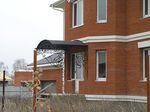 Фото кованого козырька Кованый козырек фото