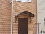 Фото кованого козырька Кованый козырек фото