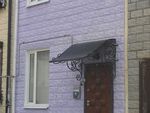 Фото кованого козырька Кованый козырек фото
